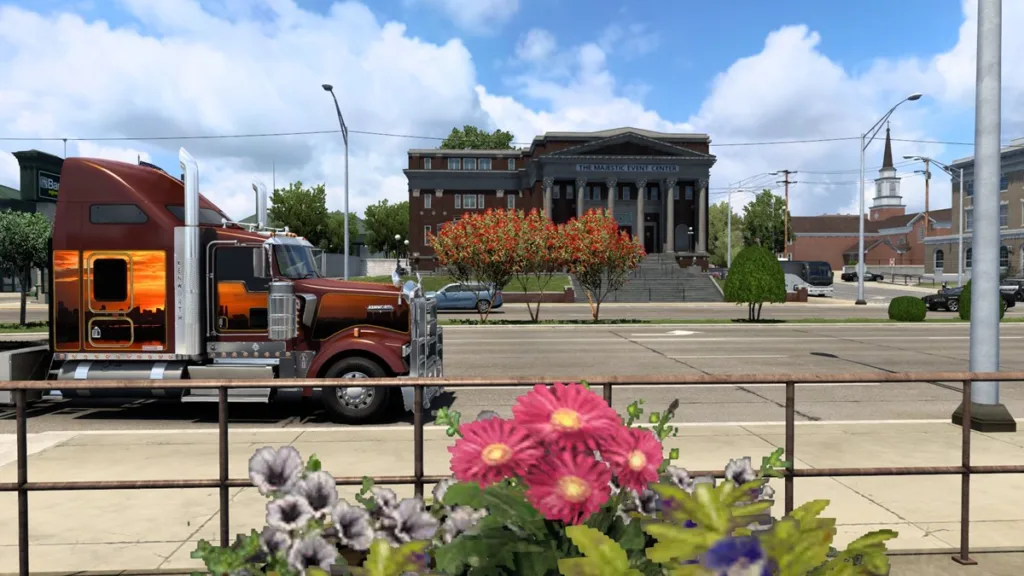 ATS - truck side view in Oklahoma with buildings and flowers