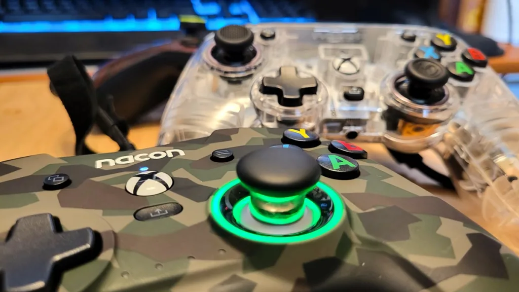 Shot of the Nacon Revolution X controller. along with the Colorlight and Xbox One controller.